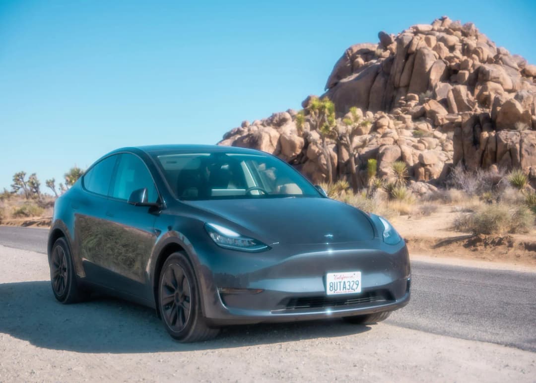 Tesla Model Y grey on the road