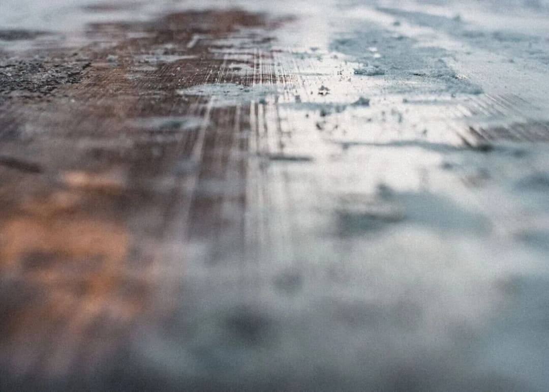 Icy road with snow on asphalt