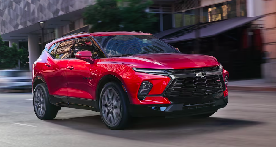 Red Chevrolet Blazer 2024 driving on city streets